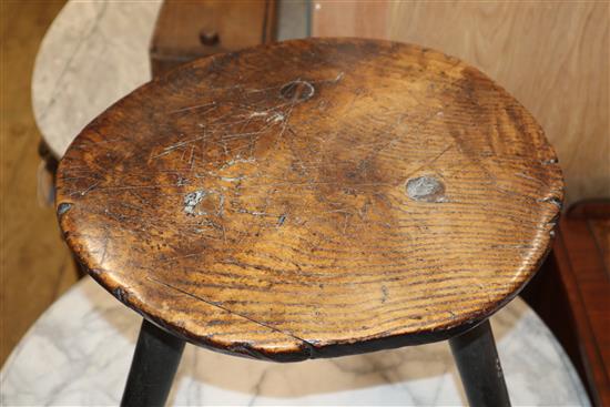 An 18th century elm primitive stool W.40cm at base